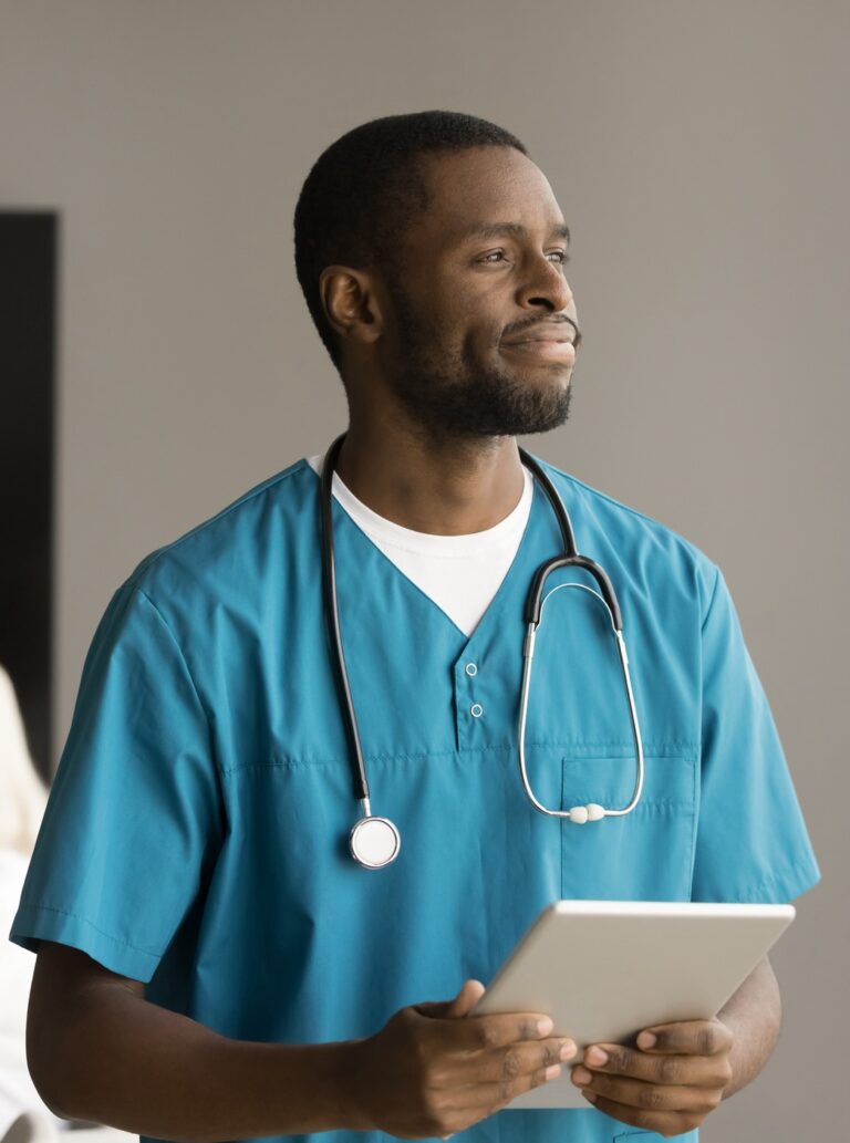 Thoughtful African American doctor holding digital tablet