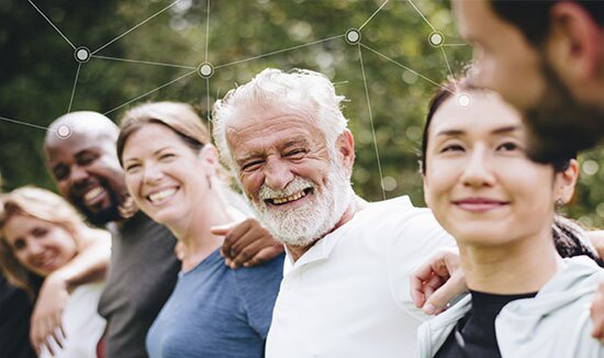 a diverse group of people, lined up side by side with their arms on each others' shoulders